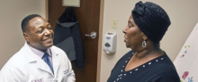 Dr. Steven Evans sitting with a patient